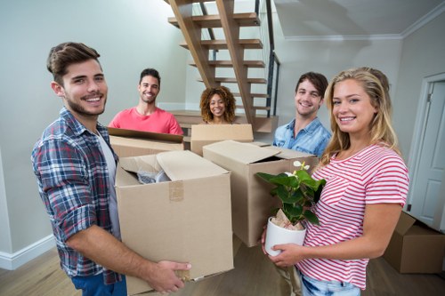 Moving van and packed boxes for a home move in Ealing