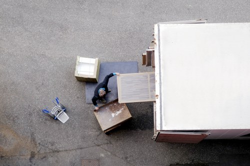 Local movers organizing boxes during a residential relocation in Ealing