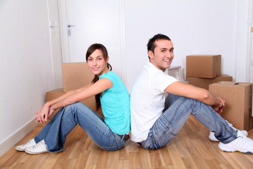 Moving team transporting household items carefully