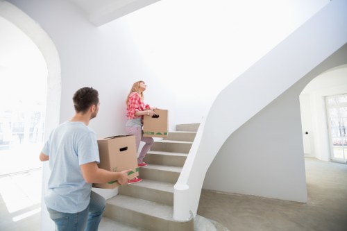 Local removal truck loading furniture and boxes in Ealing