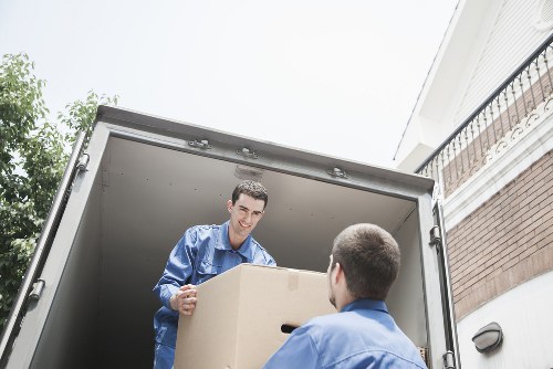 Prepared office boxes and labelled equipment for relocation in Ealing