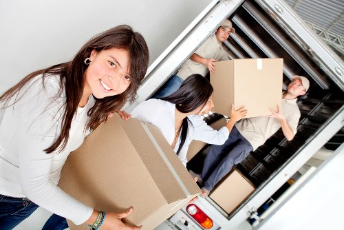 Careful unloading and furniture placement at a property in Ealing